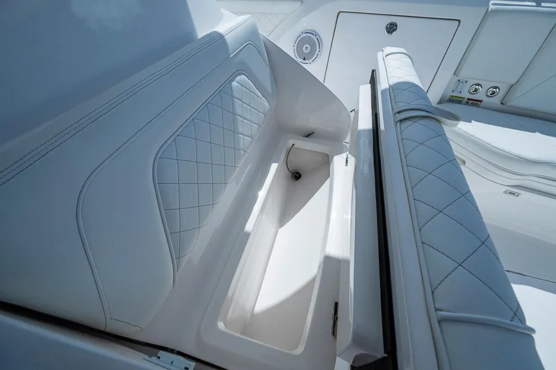Slide: The Image of 2020 Intrepid 345 Nomad FE boat seat storage compartment with quilted upholstery. - 35