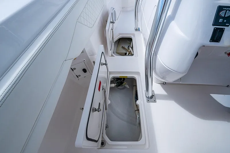 Slide: The Image of 2020 Intrepid 345 Nomad FE boat storage compartments and control panel. - 55