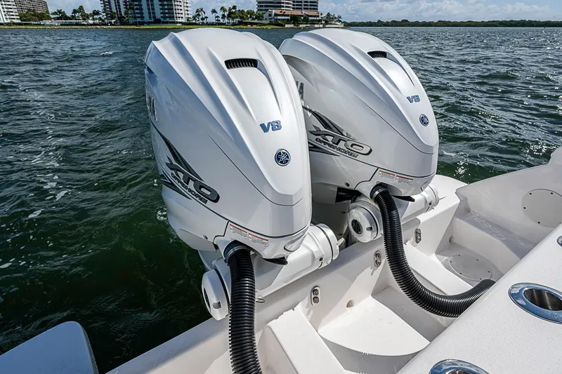Slide: The Image of Twin Yamaha V8 outboard engines on a 2020 Intrepid 345 Nomad FE boat in open water. - 58