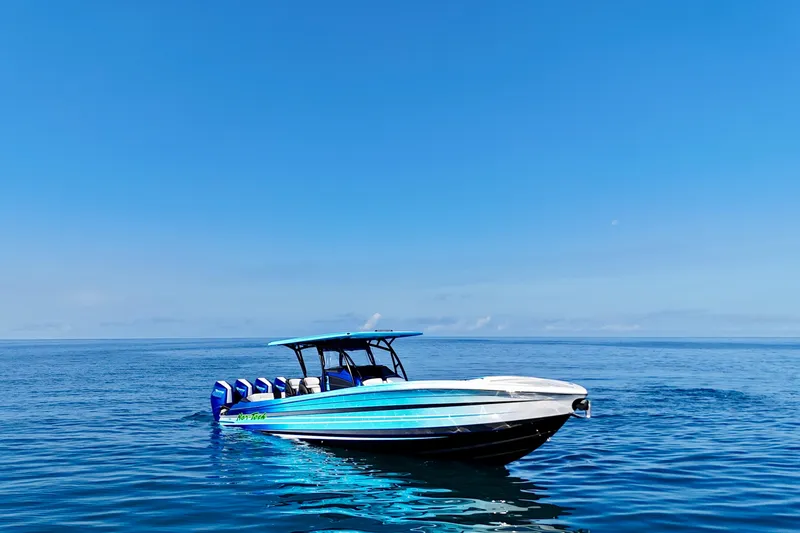 Slide: The Image of 2026 Nor-Tech 390 Sport Center Console boat on calm blue ocean. - 10