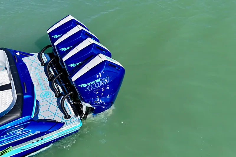 Slide: The Image of 2026 Nor-Tech 390 Sport Center Console with quad Mercury Racing 400R engines on turquoise water. - 21