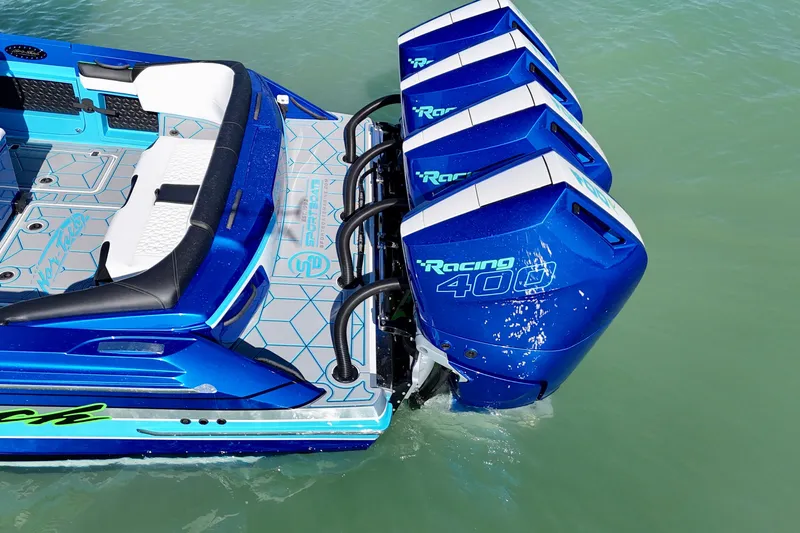 Slide: The Image of 2026 Nor-Tech 390 Sport Center Console with quad Racing 400 engines on turquoise water. - 22