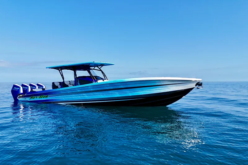 Slide: The Image of 2026 Nor-Tech 390 Sport Center Console boat on calm ocean waters. - 3