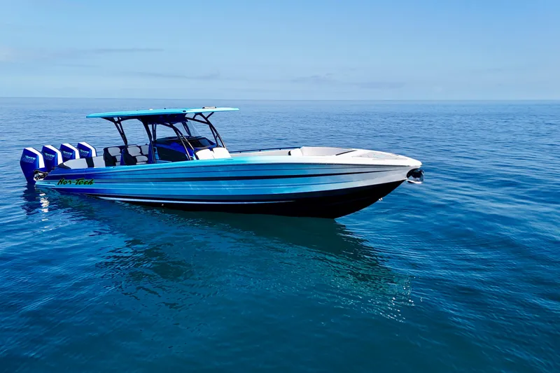 Slide: The Image of 2026 Nor-Tech 390 Sport Center Console boat on calm ocean waters. - 4