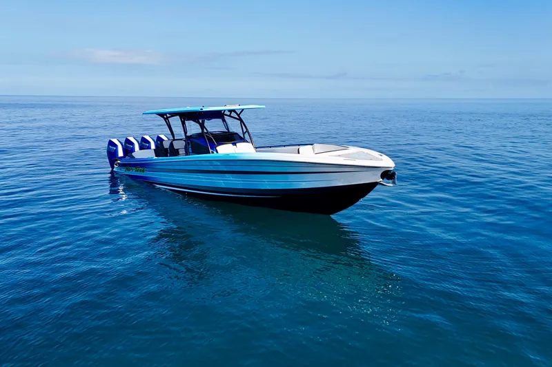 Slide: The Image of 2026 Nor-Tech 390 Sport Center Console boat on calm ocean waters. - 5