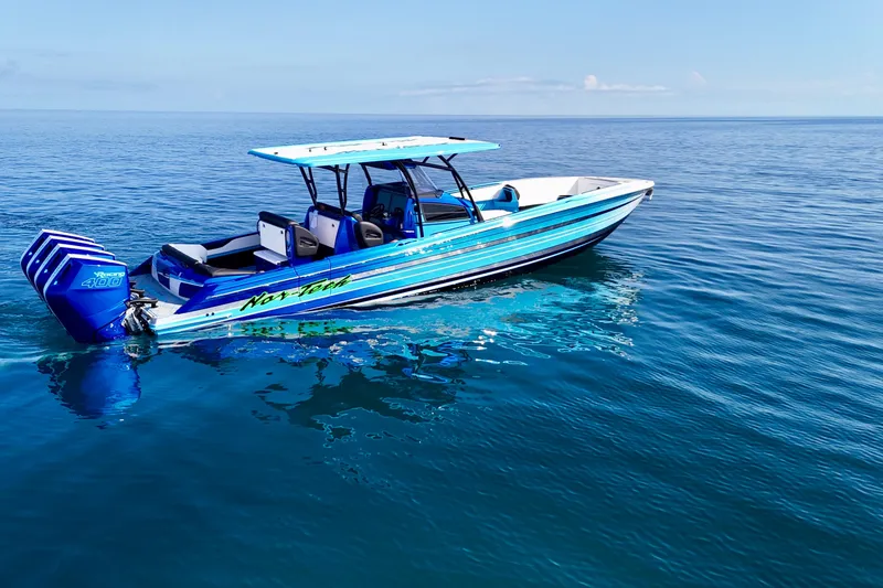 Slide: The Image of 2026 Nor-Tech 390 Sport Center Console boat on calm ocean waters. - 8
