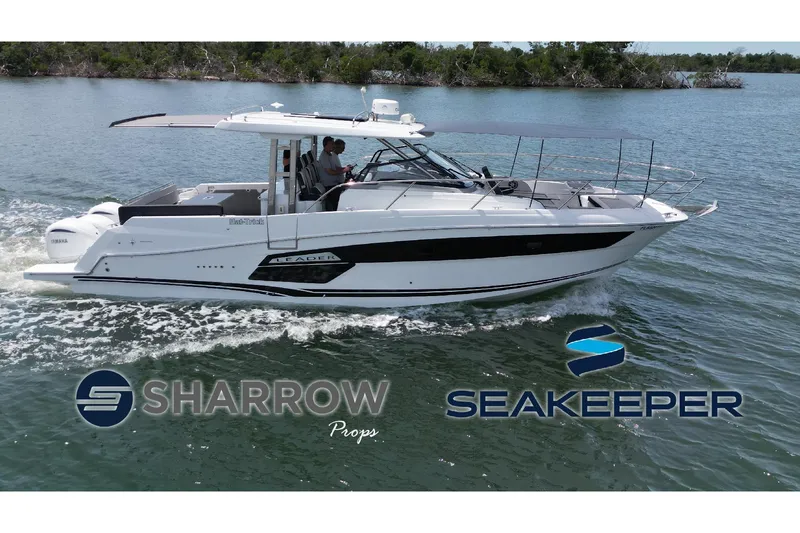 The Image of 2022 Jeanneau Leader 12.5 WA cruising on water, featuring Sharrow and Seakeeper logos. - 0