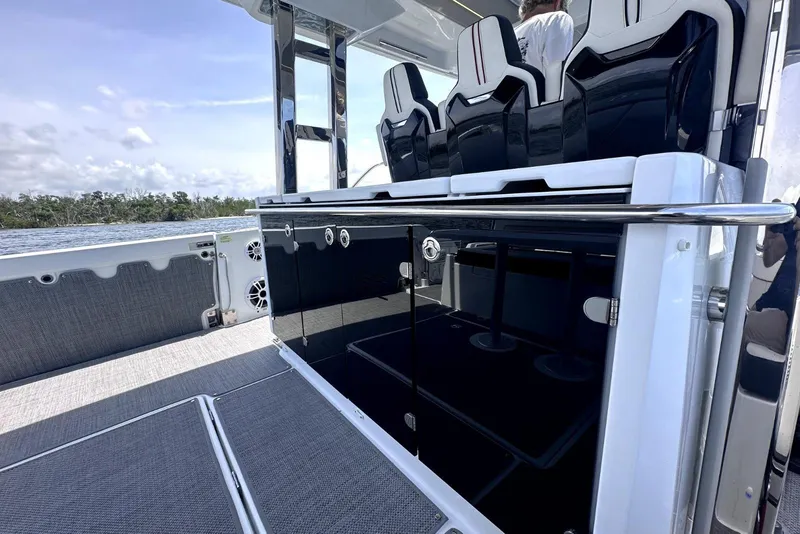 Slide: The Image of 2022 Jeanneau Leader 12.5 WA boat interior with sleek seating and modern design. - 19