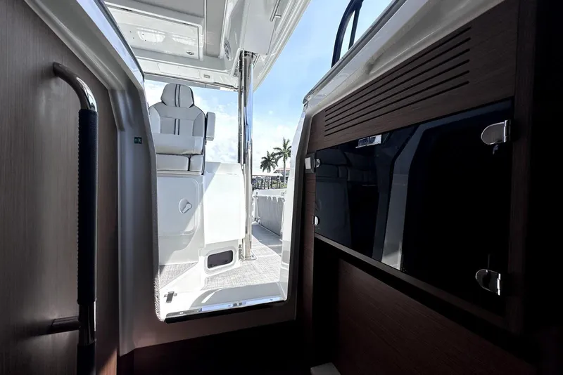 Slide: The Image of Interior view of 2022 Jeanneau Leader 12.5 WA boat, showcasing seating and cabinetry. - 27