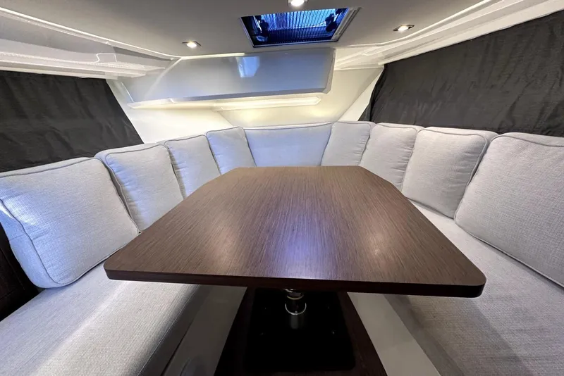 Slide: The Image of Luxurious interior of 2022 Jeanneau Leader 12.5 WA with elegant seating and wooden table. - 32