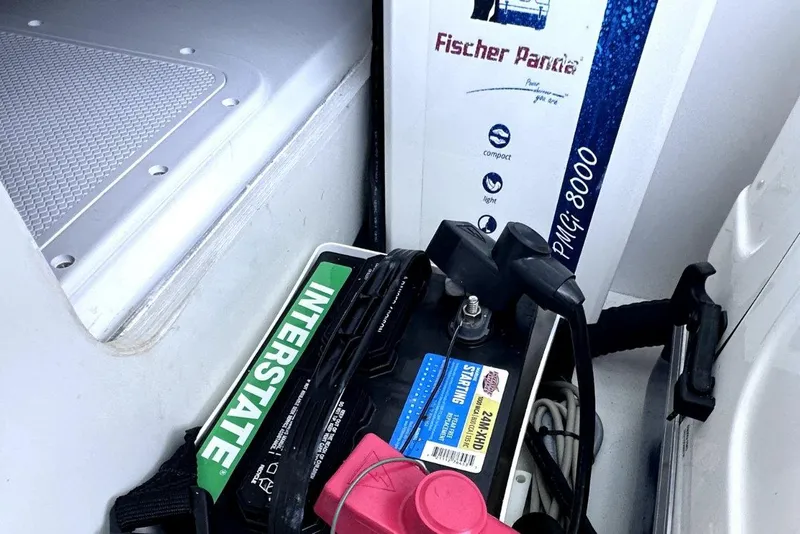 Slide: The Image of Battery and equipment storage on a 2022 Jeanneau Leader 12.5 WA boat. - 35