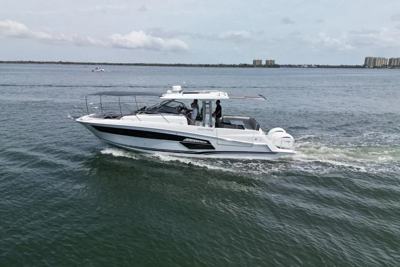 Slide: The Image of 2022 Jeanneau Leader 12.5 WA cruising on open water, showcasing sleek design and performance. - 6