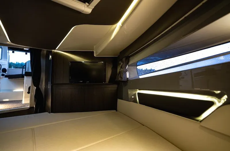 Slide: The Image of Luxurious interior of 2025 Navan C30 with ambient lighting and modern design. - 13