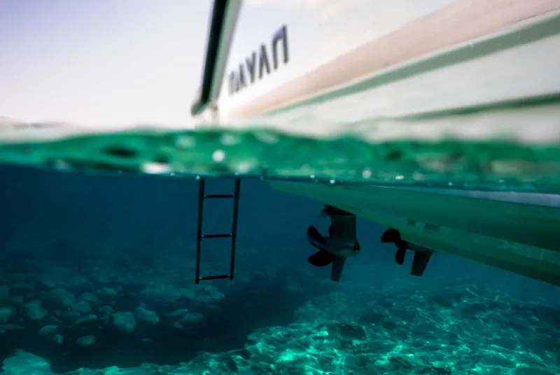 Slide: The Image of Underwater view of Navan C30 boat, 2025 model, with clear turquoise water. - 19