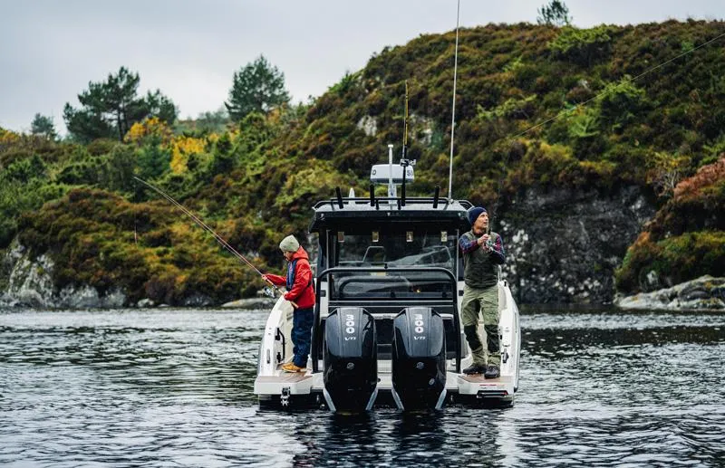 Slide: The Image of Two people fishing on a 2025 Navan C30 boat in a scenic lake. - 21