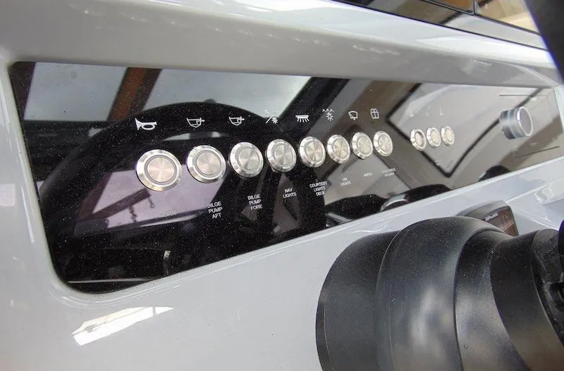 Slide: The Image of Control panel of 2025 Navan C30 boat with various buttons and indicators. - 27