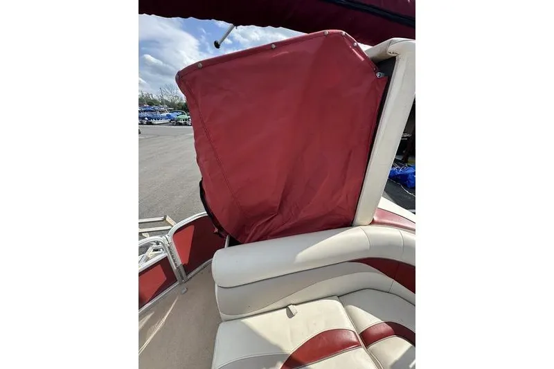 Slide: The Image of 2014 Godfrey Sweetwater 2086 C boat interior with red and white seating. - 11
