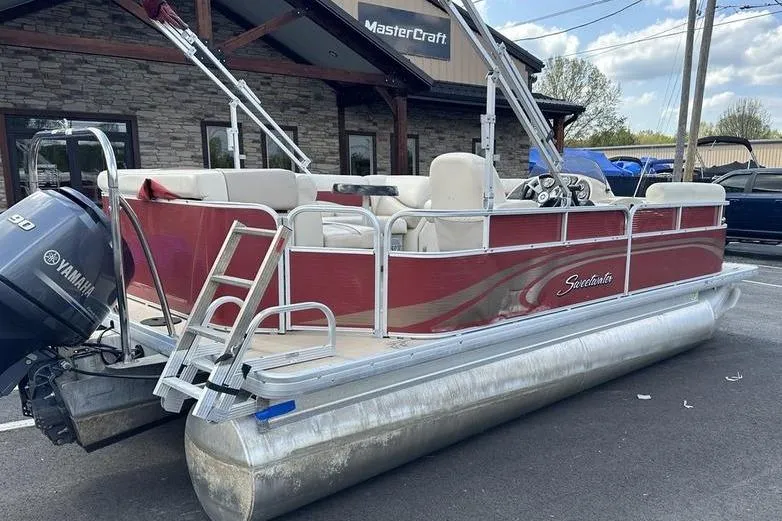 Slide: The Image of 2014 Godfrey Sweetwater 2086 C pontoon boat with Yamaha motor, parked outside MasterCraft building. - 12