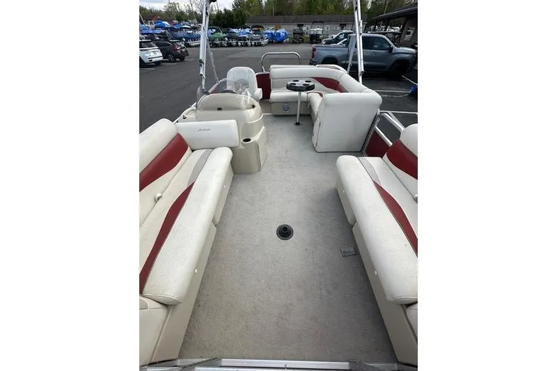 Slide: The Image of 2014 Godfrey Sweetwater 2086 C pontoon boat interior with beige and red seating. - 14