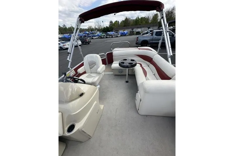 Slide: The Image of 2014 Godfrey Sweetwater 2086 C pontoon boat interior with seating and table. - 15