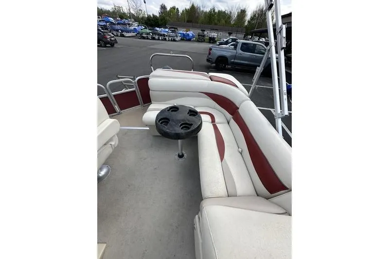 Slide: The Image of 2014 Godfrey Sweetwater 2086 C pontoon boat interior with seating and cup holder table. - 16