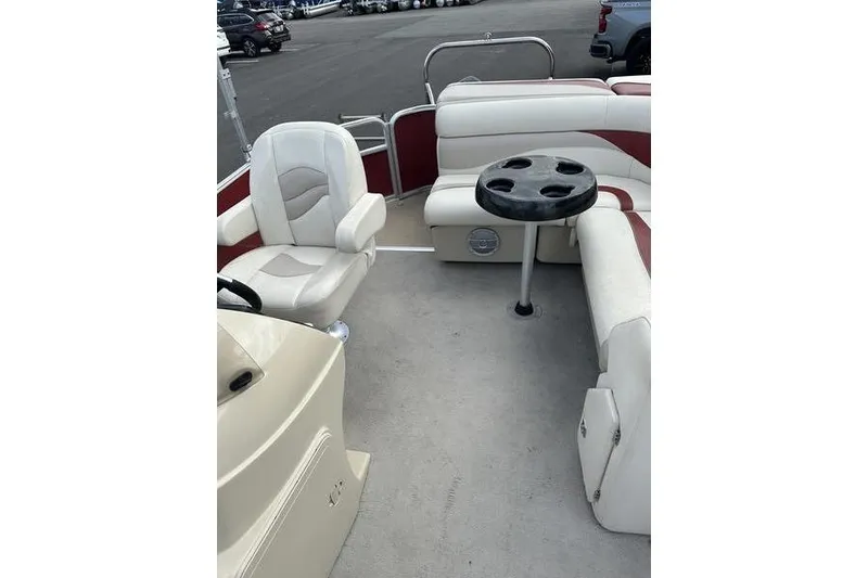 Slide: The Image of 2014 Godfrey Sweetwater 2086 C pontoon boat interior with seating and table. - 18