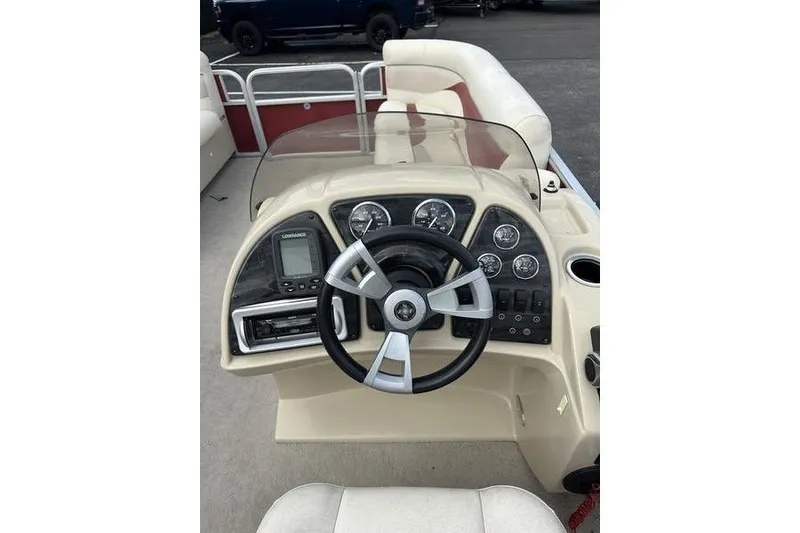 Slide: The Image of Steering console of 2014 Godfrey Sweetwater 2086 C pontoon boat with gauges and controls. - 3