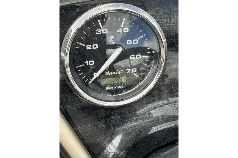 Slide: The Image of Close-up of a Faria tachometer on a 2014 Godfrey Sweetwater 2086 C boat. - 4
