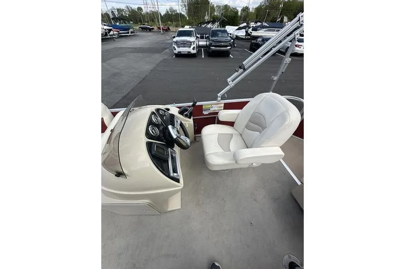 Slide: The Image of 2014 Godfrey Sweetwater 2086 C boat interior with steering console and captain's chair. - 6