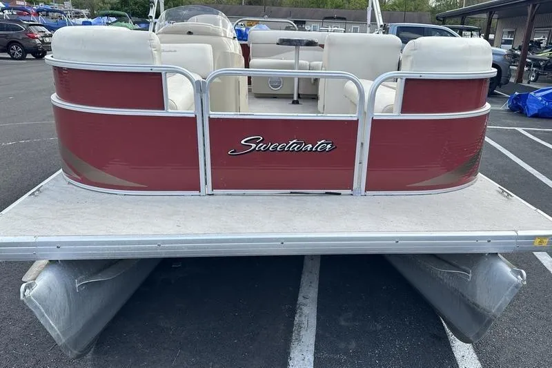 Slide: The Image of 2014 Godfrey Sweetwater 2086 C pontoon boat with red exterior and white seating. - 8