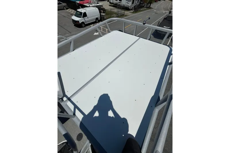 Slide: The Image of Rooftop view of 2023 Godfrey Monaco 235 SD boat, showcasing spacious deck area. - 12