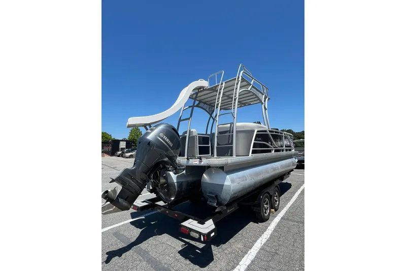 Slide: The Image of 2023 Godfrey Monaco 235 SD pontoon boat with Yamaha engine and slide, parked on trailer. - 5