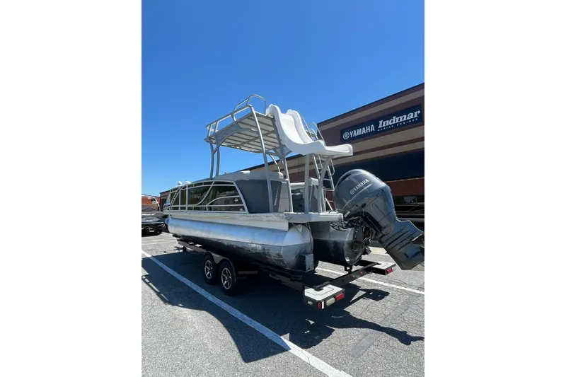 Slide: The Image of 2023 Godfrey Monaco 235 SD pontoon boat with Yamaha engine in parking lot. - 6