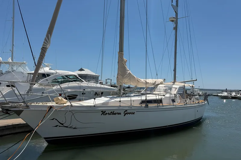 Slide: The Image of Sailboat "Northern Goose" docked, Amel Mango 52, 1980 model, in a sunny marina. - 3