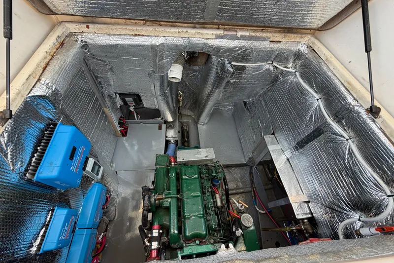 Slide: The Image of Engine room of a 1980 Amel Mango 52 yacht with insulation and equipment. - 60