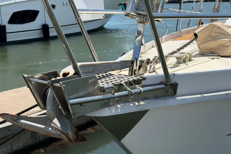 Slide: The Image of Bow of 1980 Amel Mango 52 yacht with anchor and chain at dock. - 10
