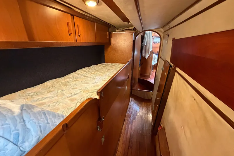 Slide: The Image of Cozy cabin interior of 1980 Amel Mango 52 sailboat with wooden furnishings. - 46