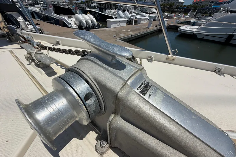Slide: The Image of Anchor winch on 1980 Amel Mango 52 yacht at marina dock. - 13