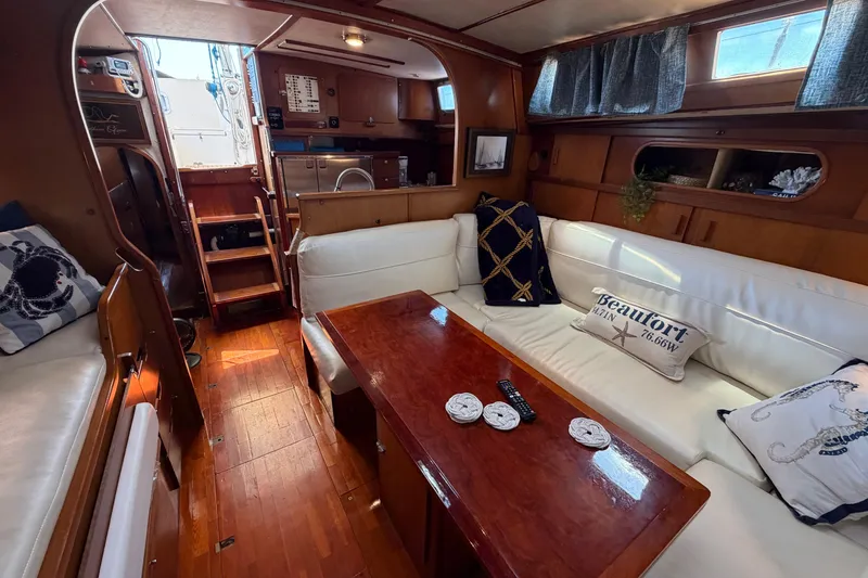 Slide: The Image of Interior of 1980 Amel Mango 52 yacht with cozy seating and wooden table. - 37