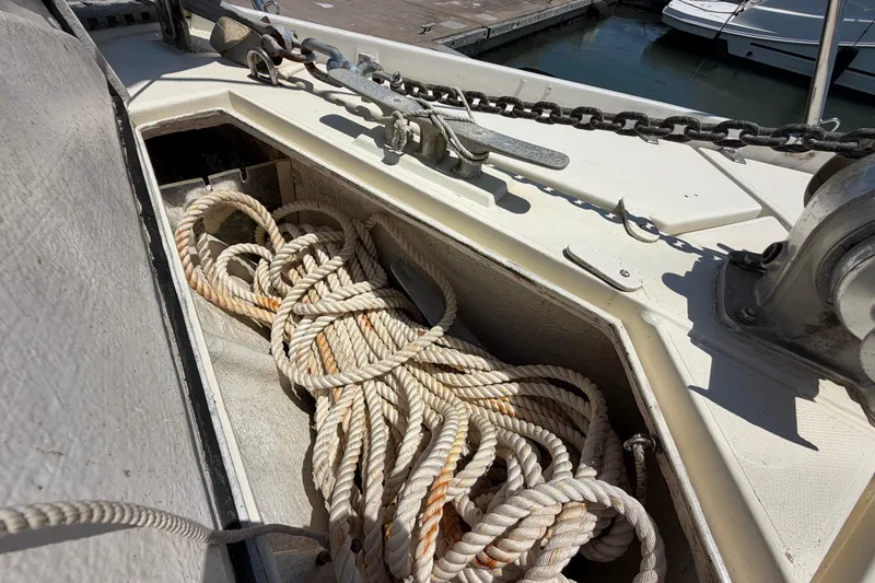 Slide: The Image of Anchor chain and rope on 1980 Amel Mango 52 sailboat deck. - 14