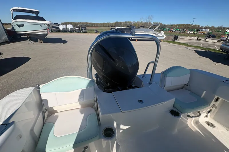 Slide: The Image of 2019 Robalo R180 Center Console boat with Yamaha engine, docked in a marina. - 6
