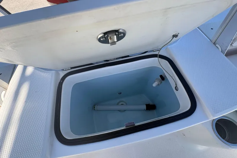 Slide: The Image of Open storage compartment on 2019 Robalo R180 Center Console boat. - 7