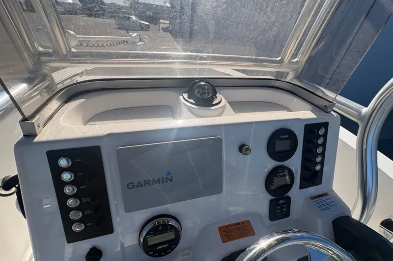 Slide: The Image of 2019 Robalo R180 Center Console dashboard with Garmin navigation system and controls. - 9