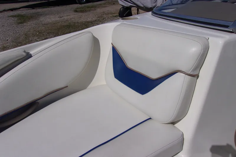 Slide: The Image of White and blue seating on a 2003 Bayliner 205 boat. - 13