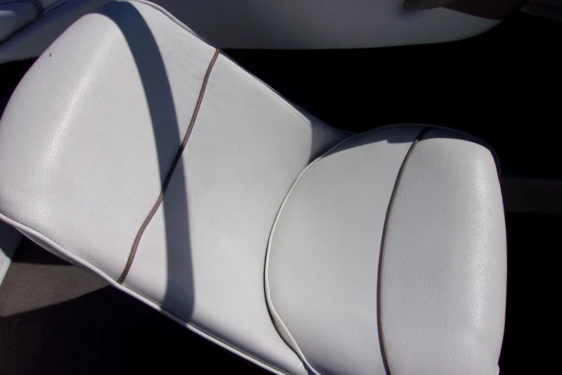 Slide: The Image of White leather seat in a 2003 Bayliner 205 boat, showcasing sleek design and comfort. - 7