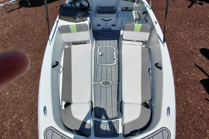 Slide: The Image of 2023 Tahoe T18 boat interior with seating and steering wheel, viewed from above. - 15