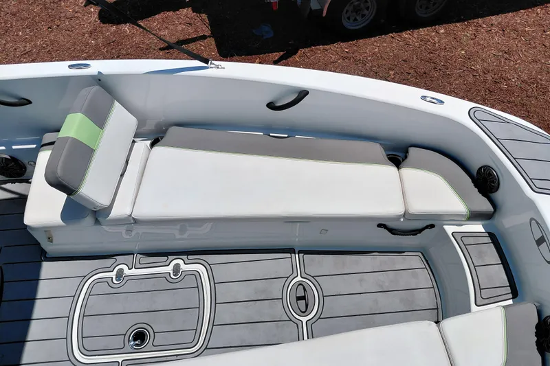 Slide: The Image of 2023 Tahoe T18 boat interior with cushioned seating and sleek design. - 16