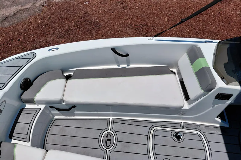 Slide: The Image of 2023 Tahoe T18 boat interior with cushioned seating and sleek design. - 17