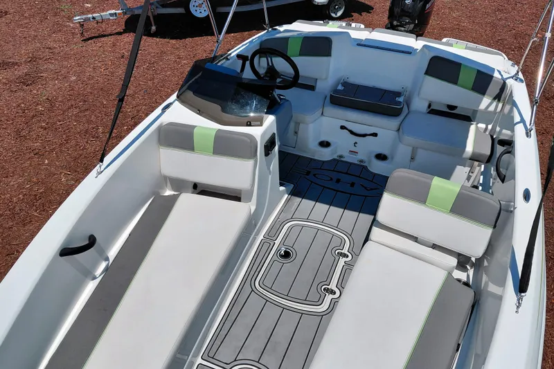 Slide: The Image of 2023 Tahoe T18 boat interior with modern seating and steering wheel. - 18