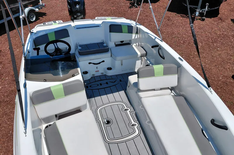 Slide: The Image of 2023 Tahoe T18 boat interior with seating and steering wheel, showcasing modern design. - 19